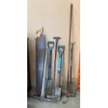 A two handled bow saw, pick axe, spades, fork,