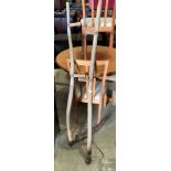 A scythe with long wood handle and a long wood scythe handle (2)