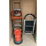 A Flymo Hover mower 240v and three small pairs of step ladders (4)