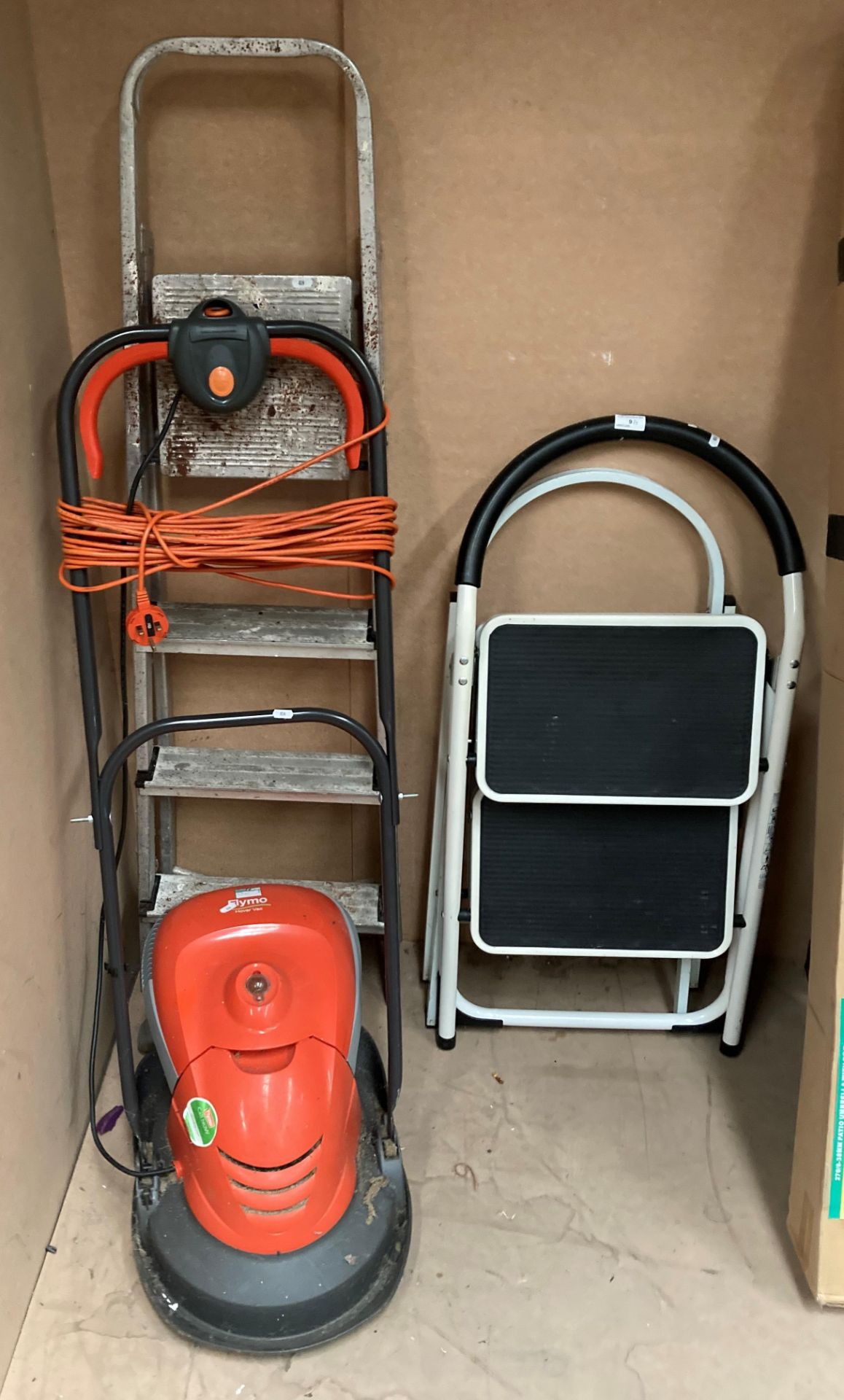 A Flymo Hover mower 240v and three small pairs of step ladders (4)