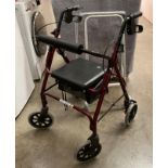 A red metal four wheel mobility walking aid and a grey metal two wheel mobility walking aid (2)