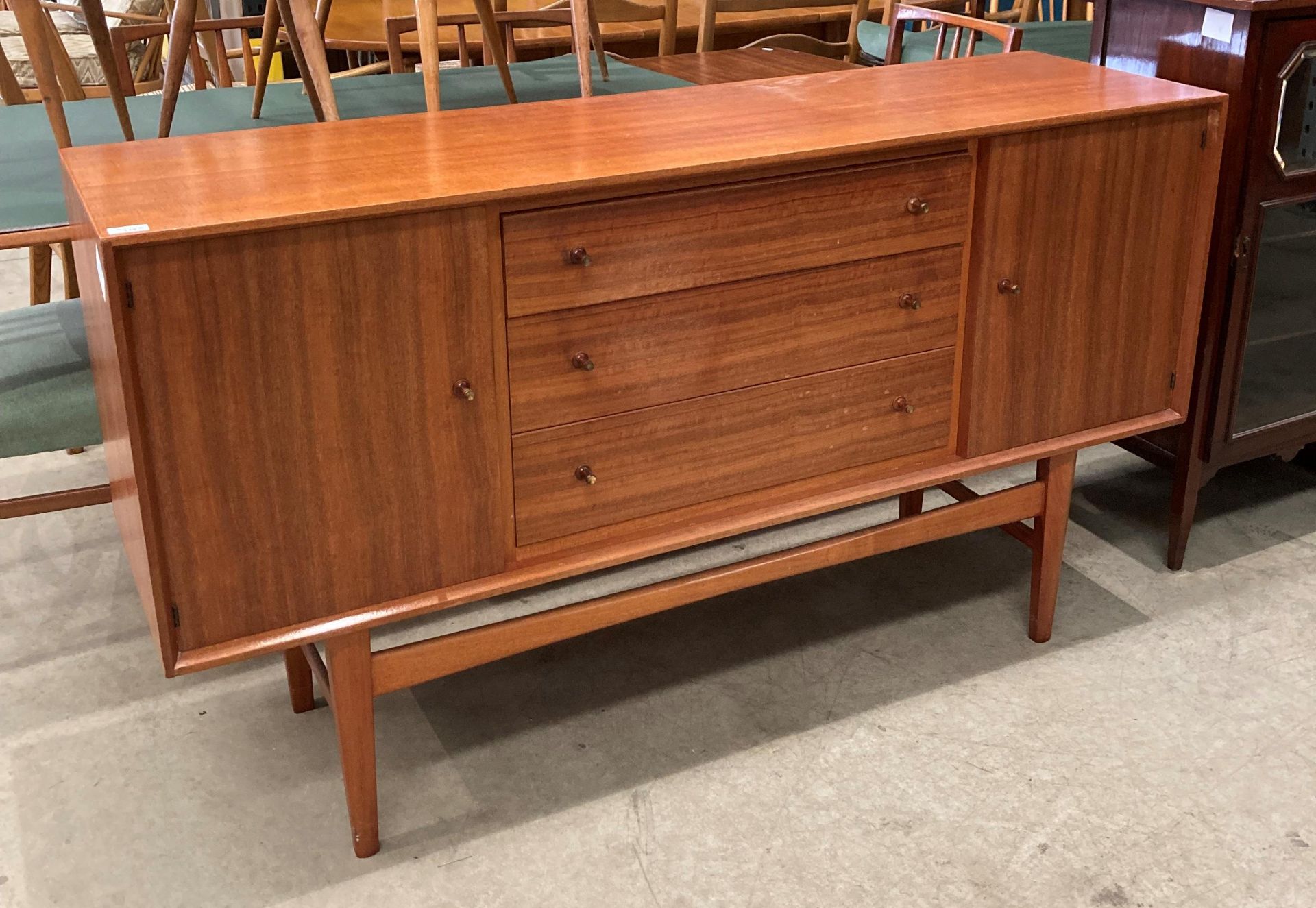 A Gordon Russell Bromley Works 1950s/1960s teak dining suite comprising extending dining table (one
