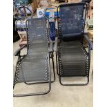 Two patio/garden sun loungers with black material and black metal frame