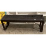 A dark wood slatted garden bench/potting table 135 x 37cm