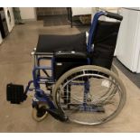 A Pharmore Mobility blue metal framed folding wheelchair