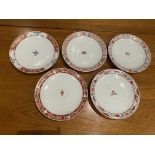 A set of five Japanese plates with central floral motif with painted border,