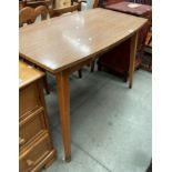 A brown formica topped kitchen table 107cm x 60cm
