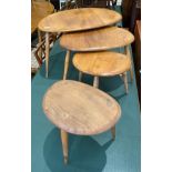 A nest of three Ercol blond elm pebble nesting coffee tables and a similar table (4)