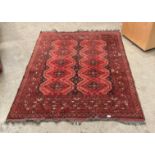 A Pakistan handmade 100% wool oriental rug in red and dark blue pattern 195 x 148cm