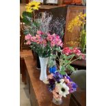 Seven various artificial flower and twig arrangements/plants in various containers