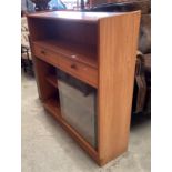 A Parker Knoll teak wall unit with open shelf and two drawers over two sliding soors 103 x 106cm