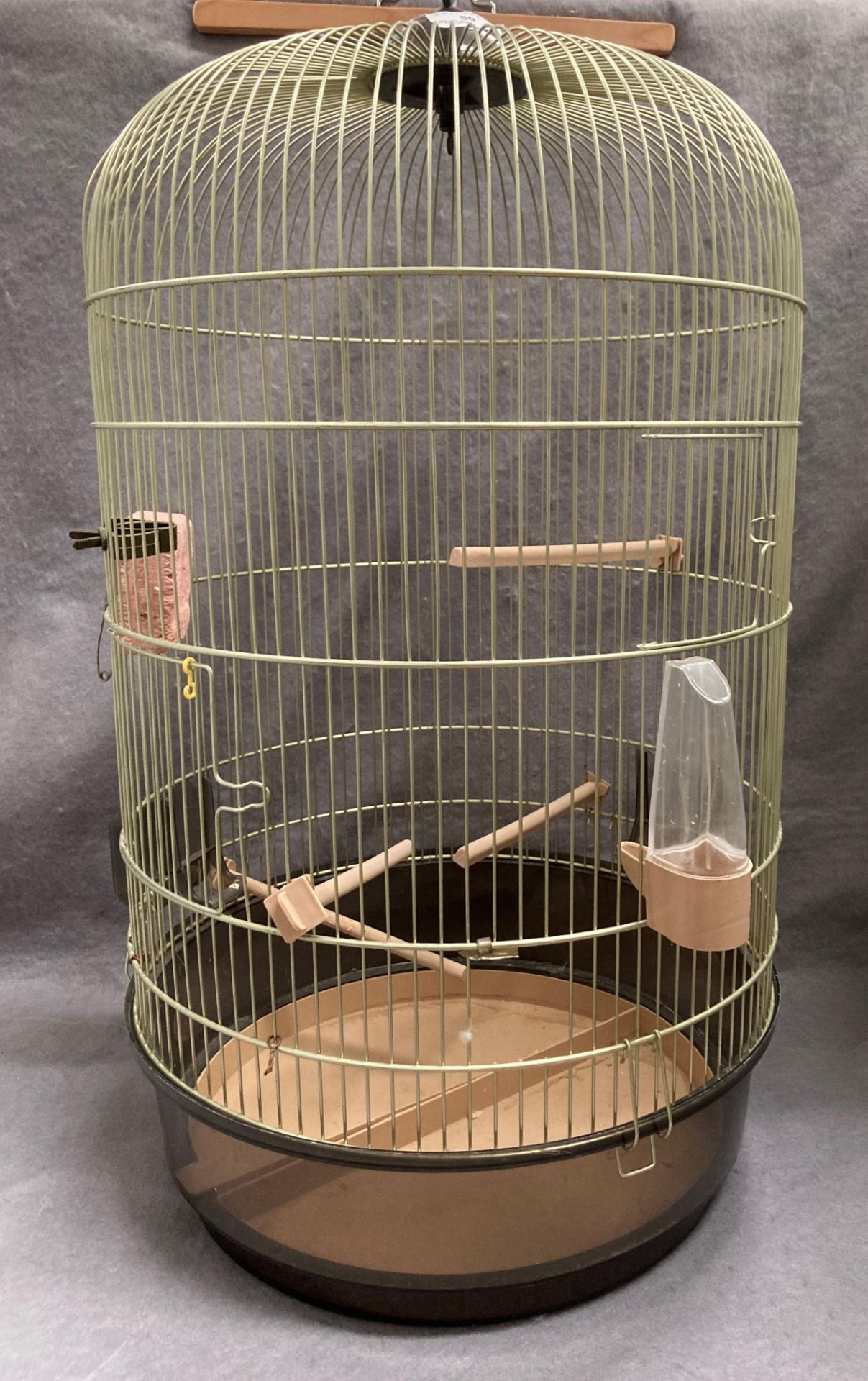 A birdcage with domed top approximately 70cm high x 40cm dia