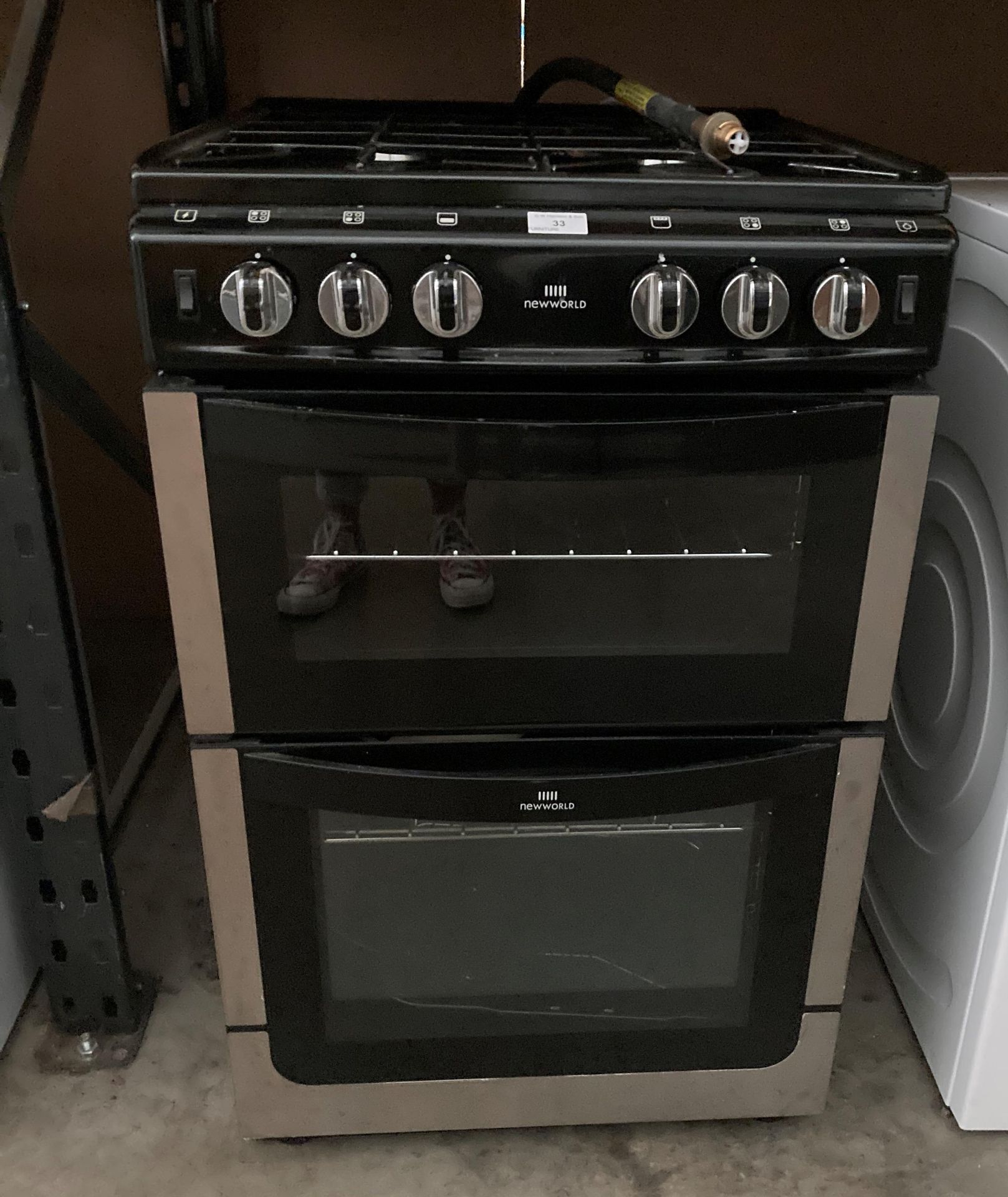 A New World gas cooker (stored in a garage and appears unused) Further Information