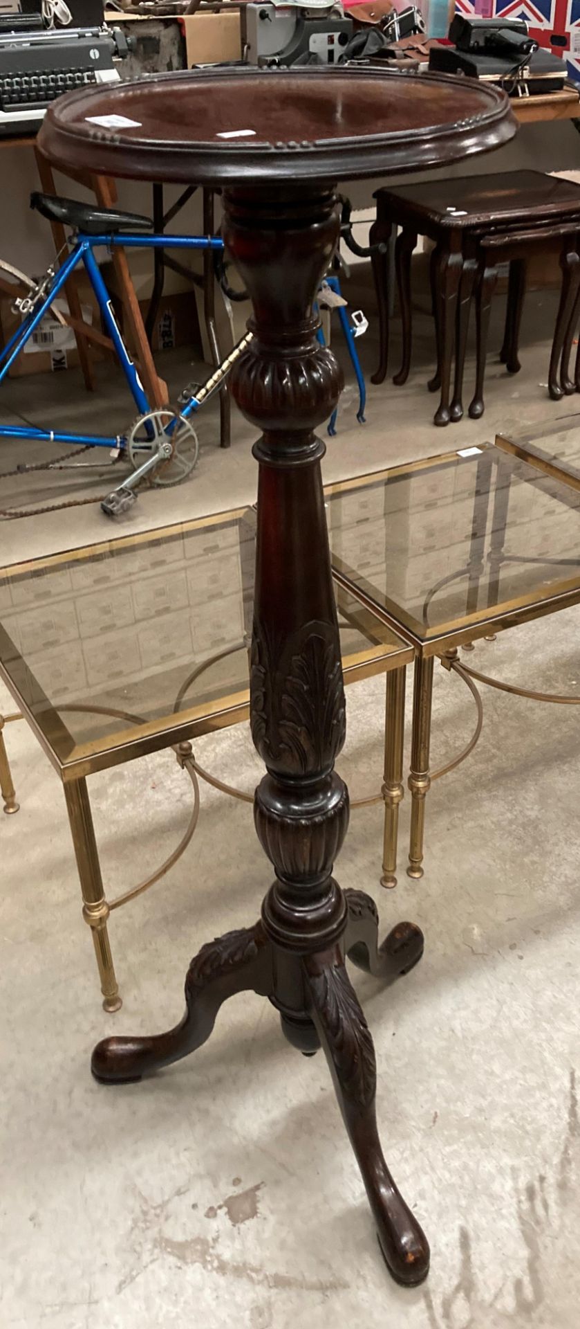 A stained mahogany tripod base plant stand