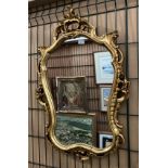 Ornate gilt framed wall mirror