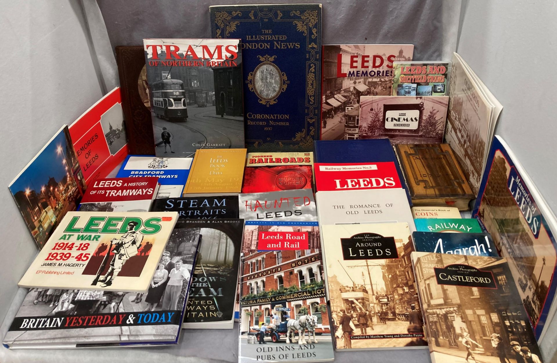 A cardboard box containing approximately thirty books relating to Leeds, railways, etc.