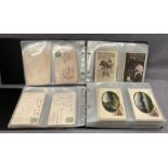Two postcard albums containing approximately 380 postcards - various genres, places of interest,