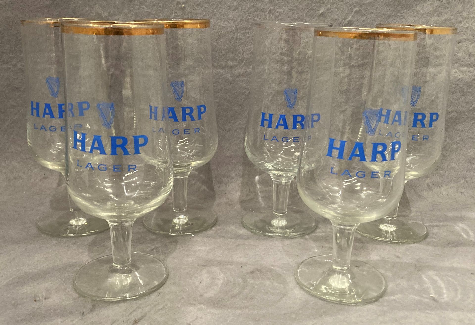 Six vintage Harp Lager stemmed glasses