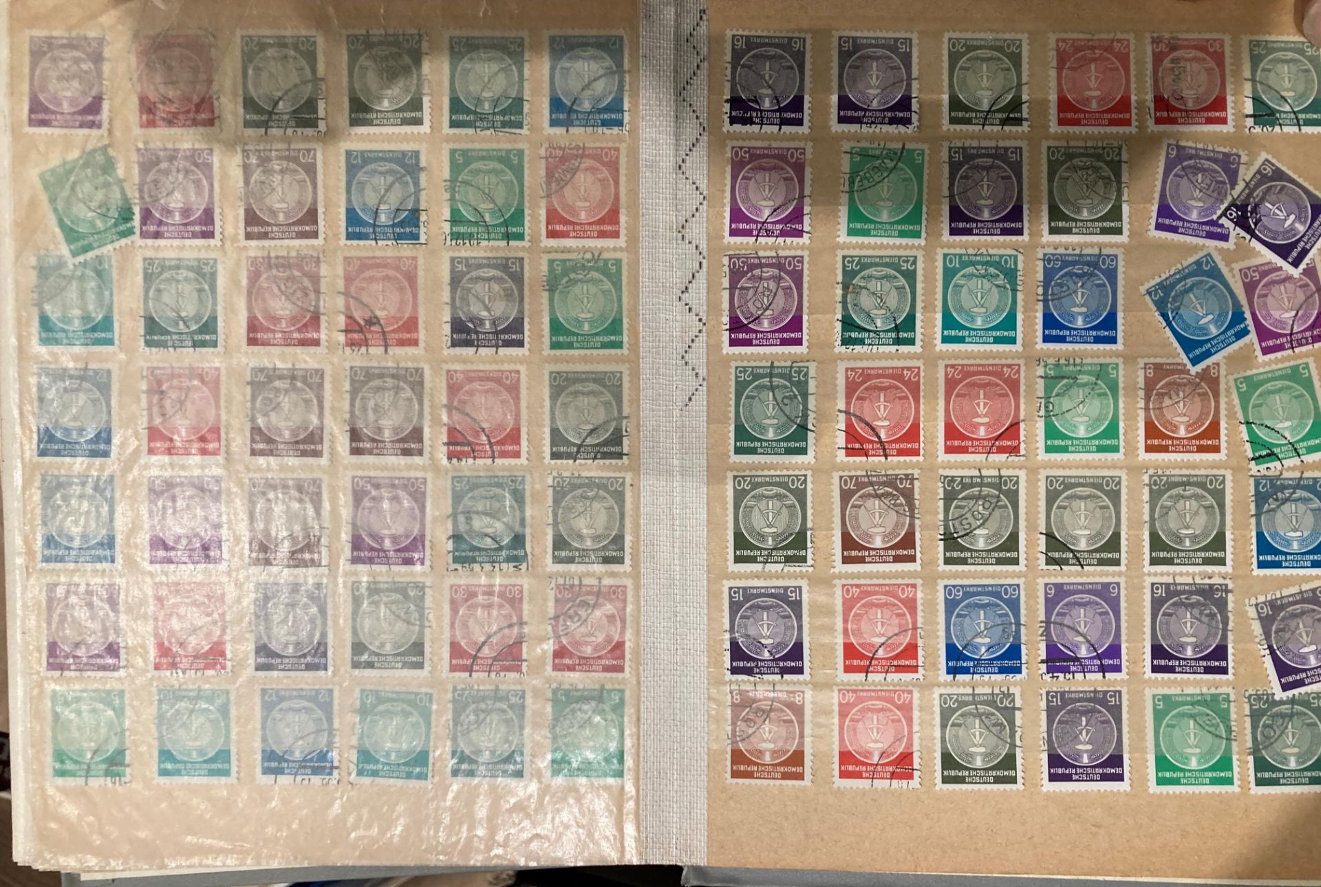 A box containing approximately fifteen various signed stamp albums and contents,