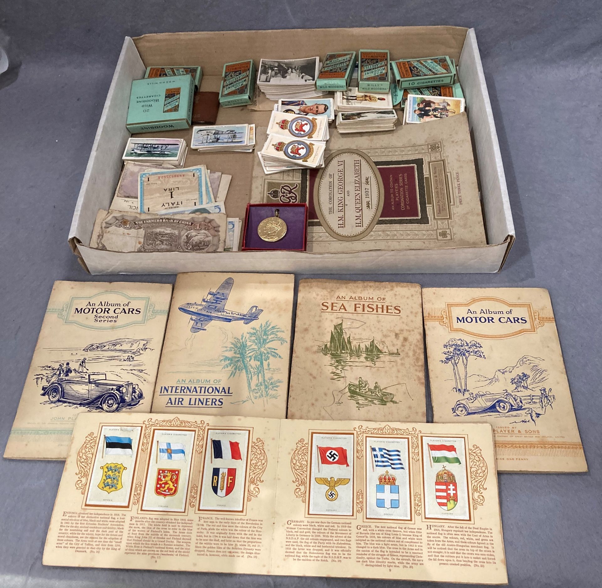 Contents to tray - seven albums of cigarette cards, John Player & Sons 'Sea Fishes',