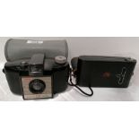 An Eastman Kodak Co Series III vest pock camera in case and a Kodak Brownie 127 camera in case (2)