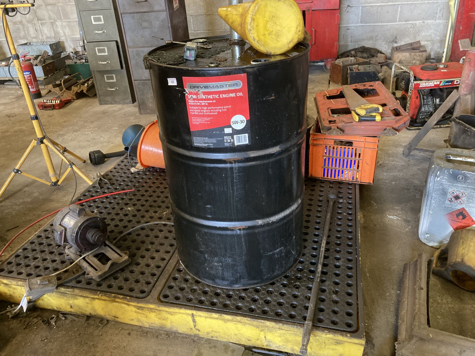 Yellow bunded oil plinth complete with part drum semi synthetic engine oil and dispenser and 19 x
