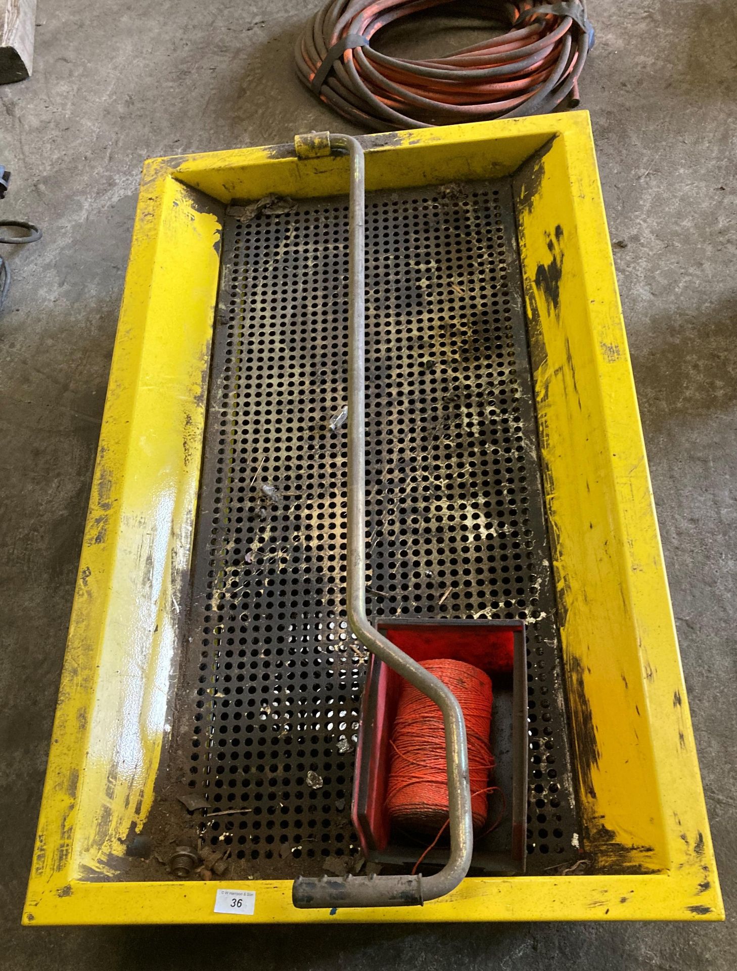 Yellow painted metal waste fluid tray