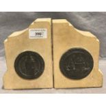 A pair of stone bookends with pewter plaques - 'London 1941 - Bombed Burned but Unbeatable' and