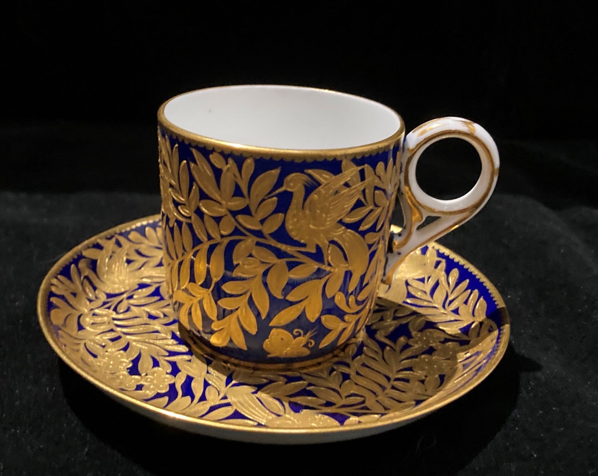 A Derby blue and gilt patterned cup and saucer