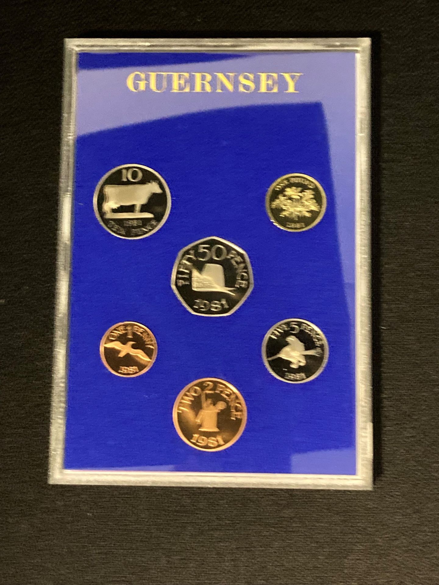 A Royal Mint Coinage of Guernsey 1981 proof set in original blue envelope and sealed plastic case - Image 2 of 3