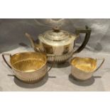 A silver three piece tea service, teapot stamped to base Fattorini, Bradford,