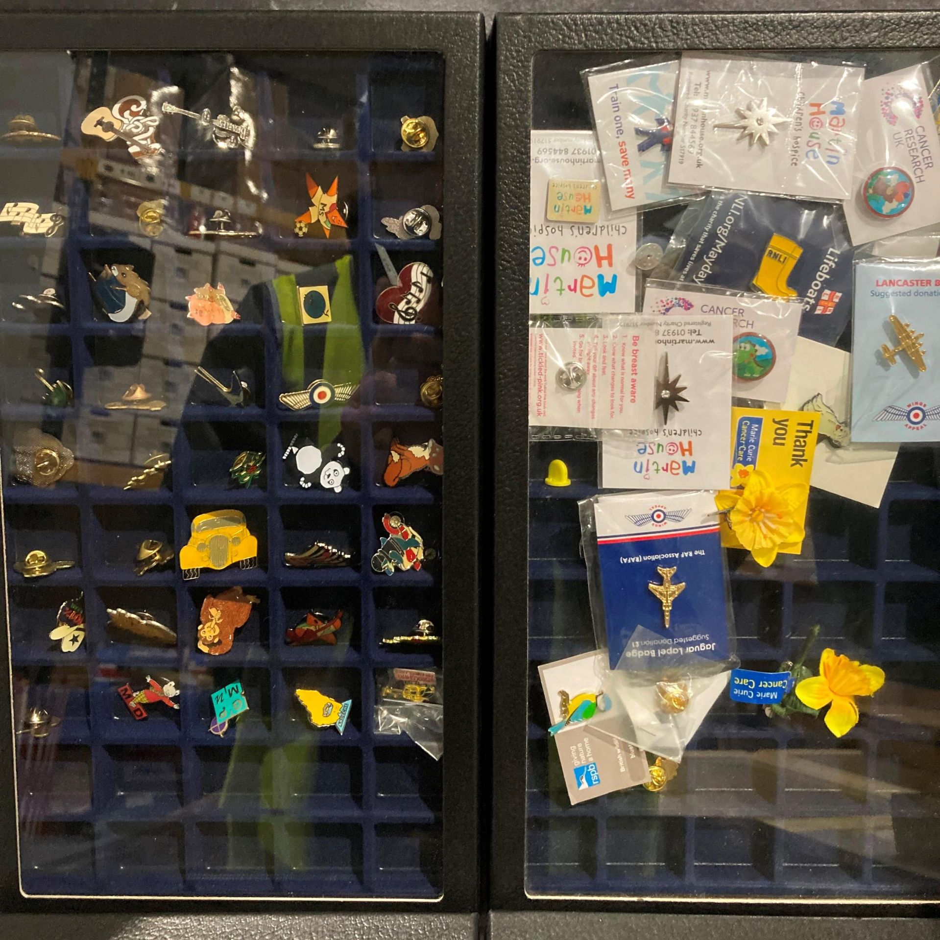 An interesting collection of mainly modern enamel badges housed in four blue display cases - Image 3 of 3