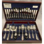 An Amefa fifty-eight piece (eight person) stainless canteen of cutlery in oak finish case