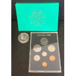 A Tuvalu 1981 Five Dollars Silver coin together with a Royal Mint the First Coinage of Tuvalu 1976