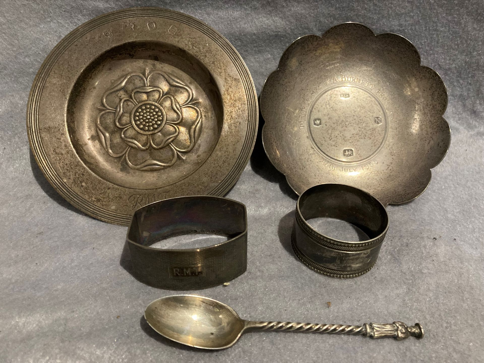 Two small silver dishes, a silver napkin ring, a silver spoon, total approximate weight 7. - Image 2 of 2