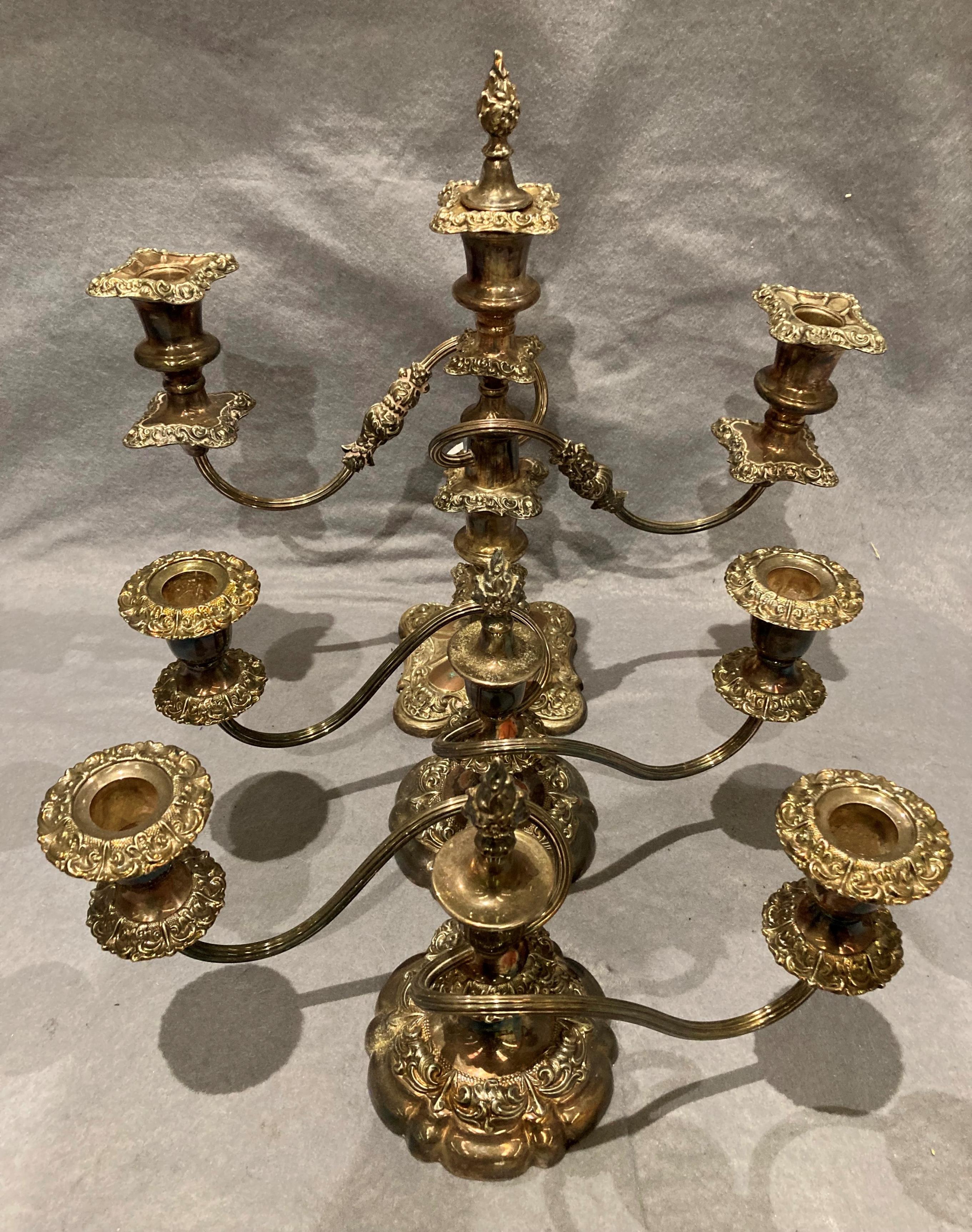 A pair of silver plated candelabrum and another silver plated candelabra (3)