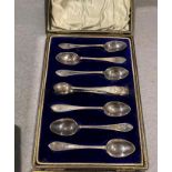 Six silver teaspoons and a pair of silver sugar tongs in fitted black case - total approximate