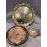 A plated circular tray with pierced rim, 29cm diameter, a plated engraved circular tray,