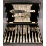 A cased fourteen piece plated fish knife and fork set with mother-of-pearl handles