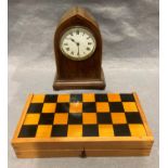 A mahogany cased bracket clock with French movement and a travel chess set (2)