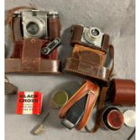 Contents to box - vintage cameras - Paxette in brown leather case,