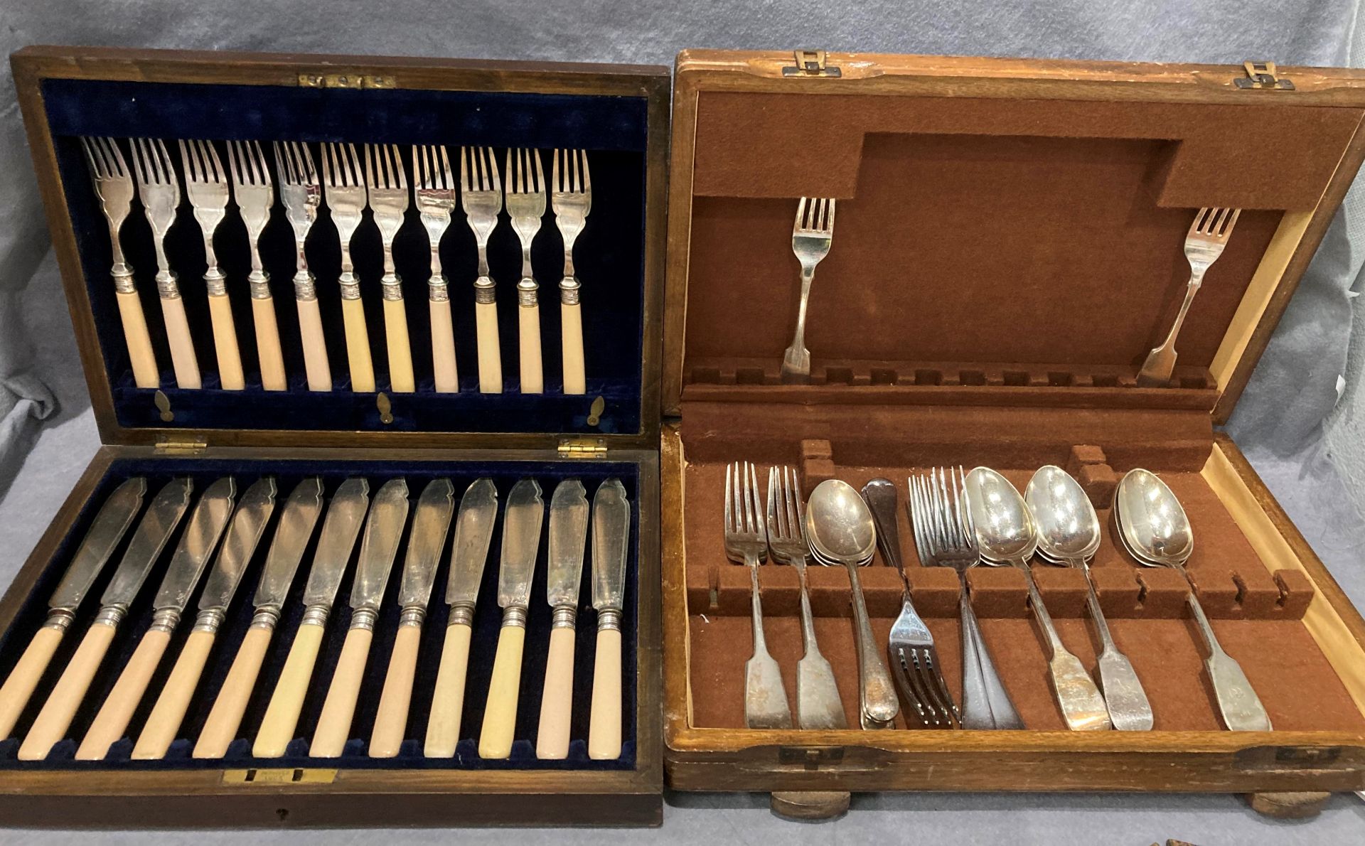 Two wooden cutlery canteens,