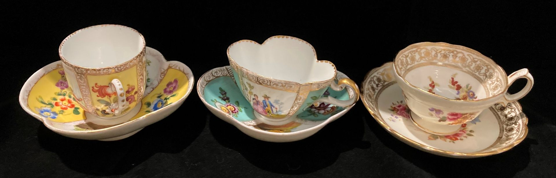 Three patterned cups and saucers - two Dresden and one Hammersley-Dresden sprays