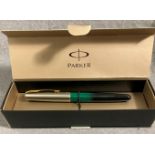 A Parker Fountain pen in green and black with silver coloured top (boxed)