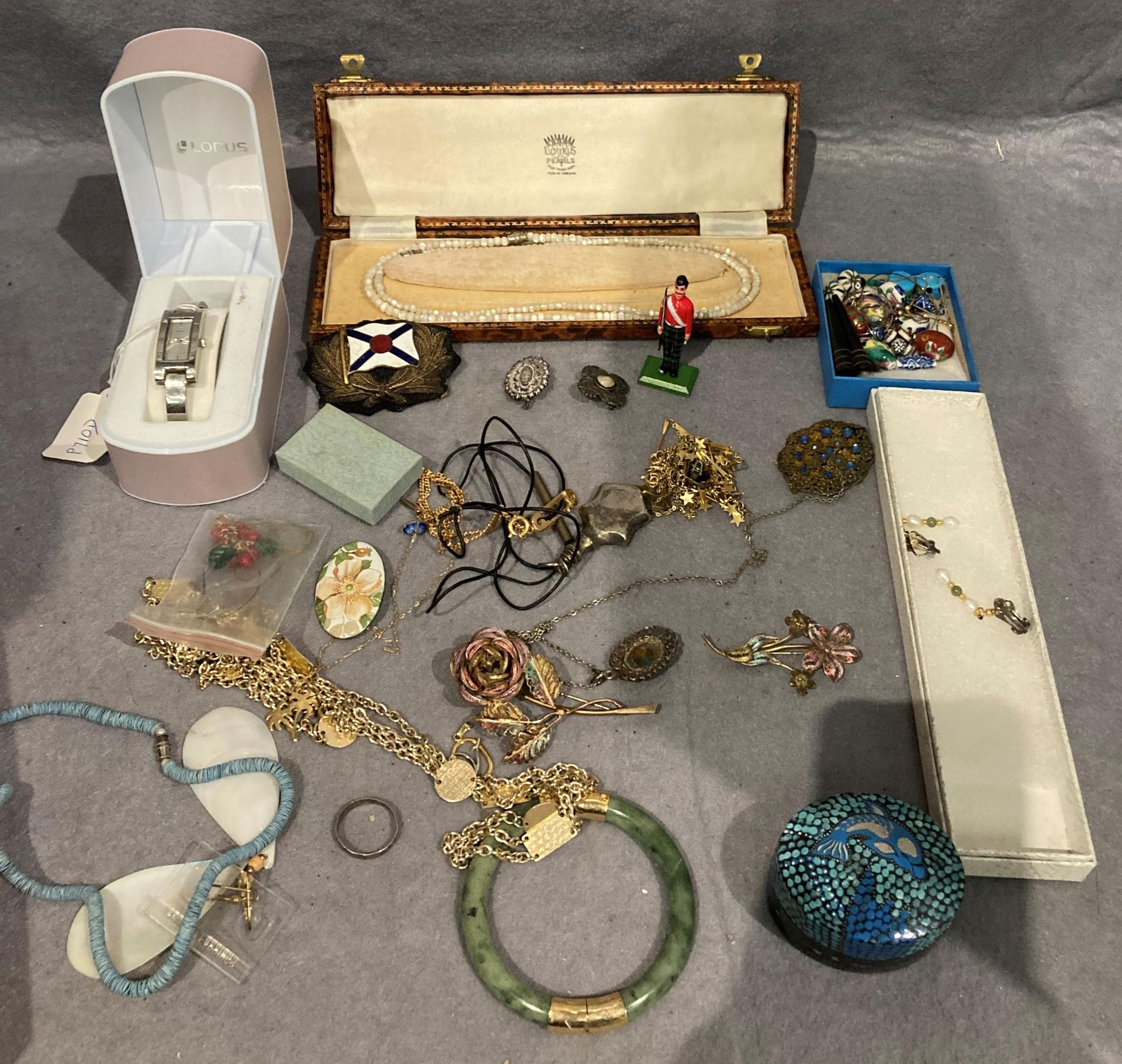Contents to box assorted costume jewellery, brooches, necklaces, earring, metal model soldier,