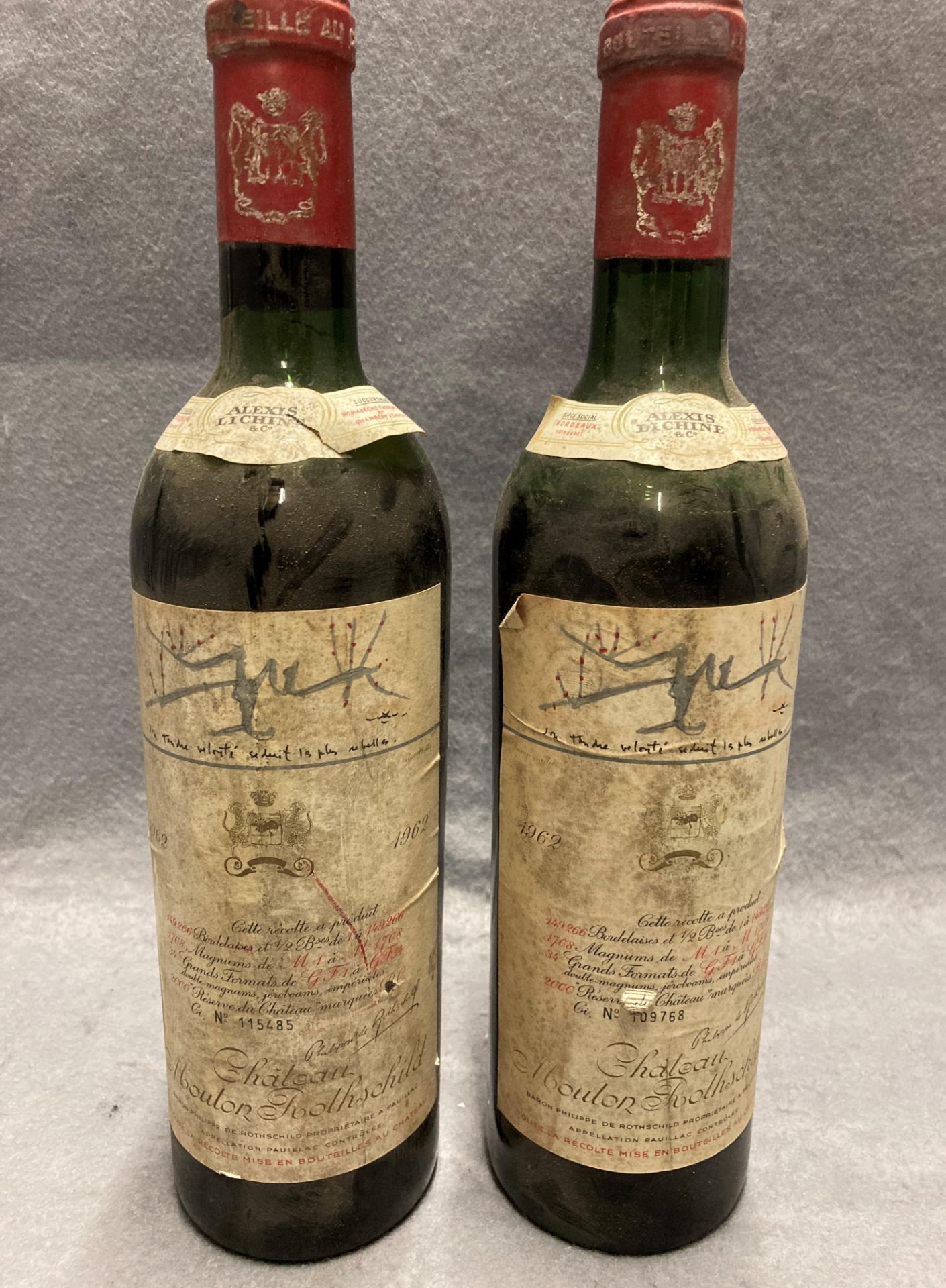 Two 75cl bottles of 1962 Chateau Mouton Rothschild No 115485 and 109768 - advised stored cellared