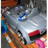 A child's moulded plastic Audi TT ride in by car - no steering wheel, sold as seen.