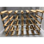 A 30 bottle metal and wood wine rack