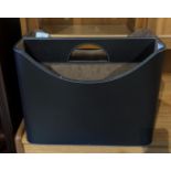 A brown leather two division portable magazine rack