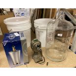 Six 20 litre wine making plastic buckets, a large glass wine demijohn,